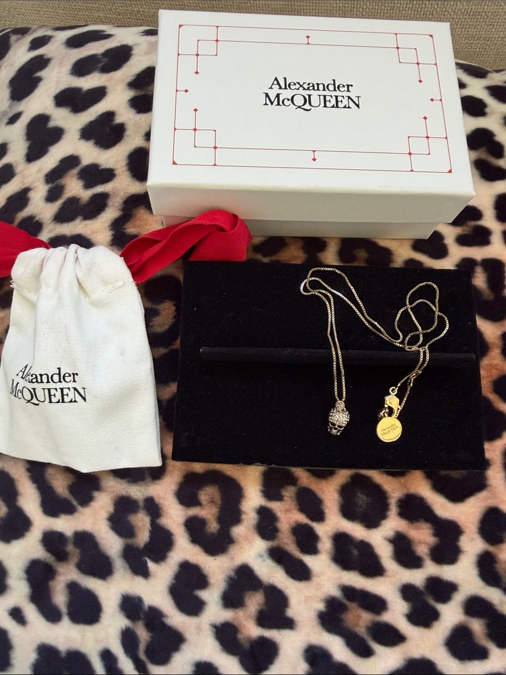 Alexander McQueen Gold Tone Skull Pendant Necklace with Branded Tag chain 10 ins